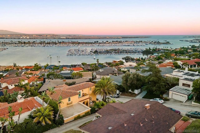 aerial view at dusk with a water view