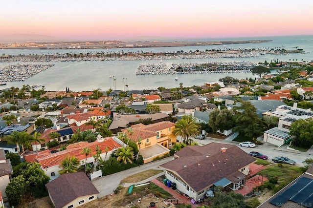 aerial view at dusk with a water view