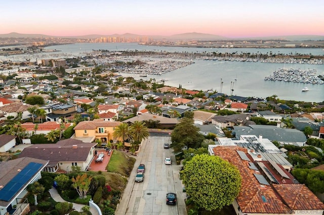 aerial view at dusk with a water view