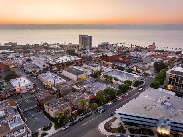 aerial view at dusk with a water view