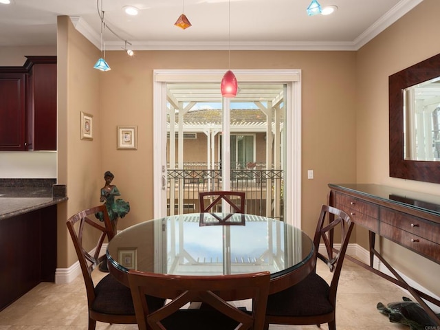 dining space with light tile patterned floors and crown molding