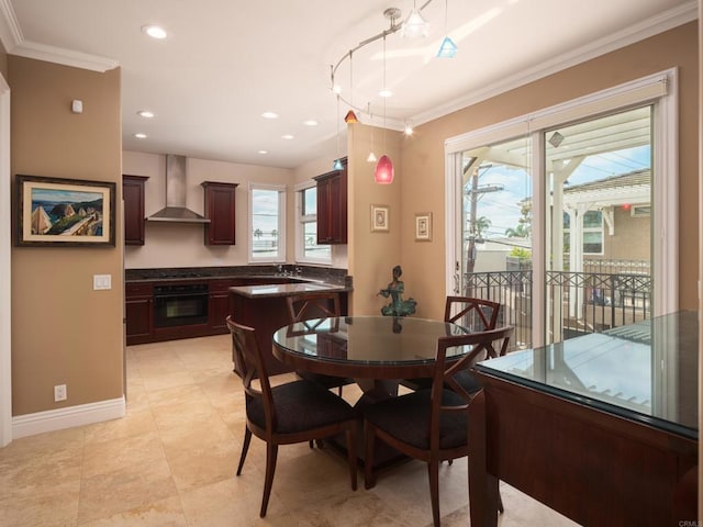 dining space with ornamental molding