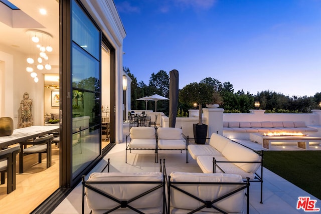 patio terrace at dusk with a fire pit