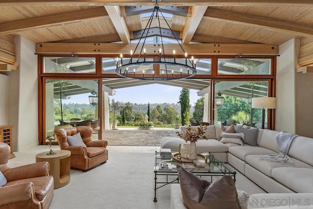 interior space featuring lofted ceiling with beams, a notable chandelier, and wood ceiling