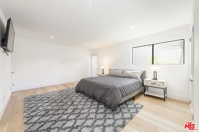 bedroom featuring light wood-type flooring