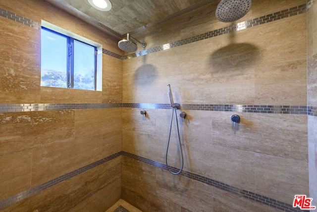 bathroom with tiled shower