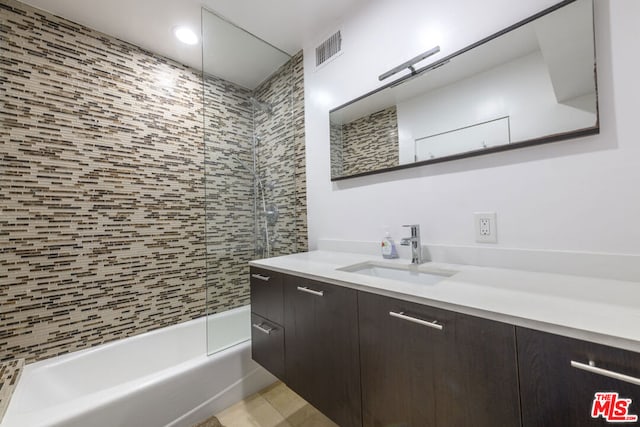 bathroom featuring tub / shower combination and vanity