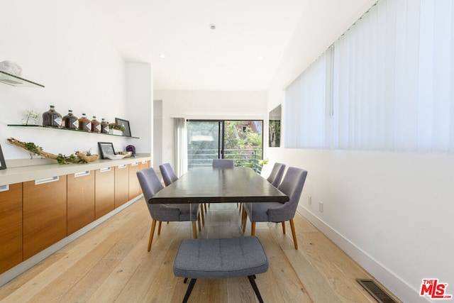 dining area featuring light wood-type flooring