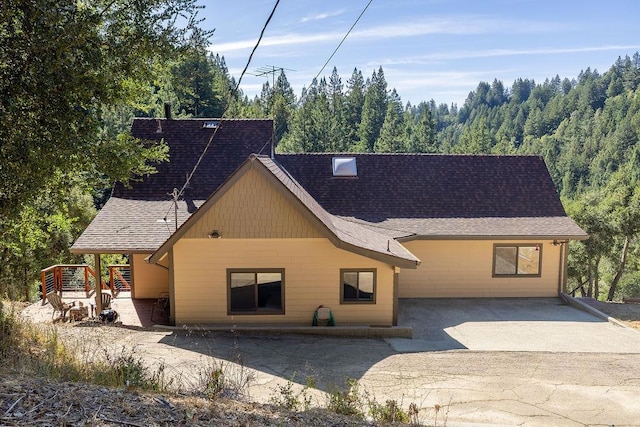 back of property with a patio