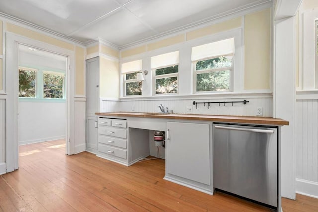 kitchen with light hardwood / wood-style floors, white cabinets, dishwasher, and wooden counters