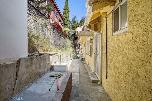 view of side of property with a patio area