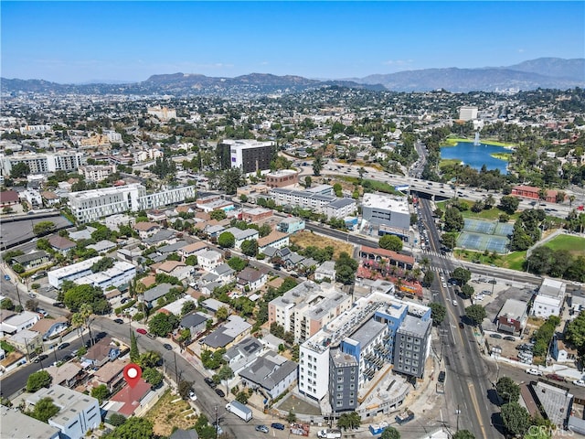 bird's eye view with a water and mountain view