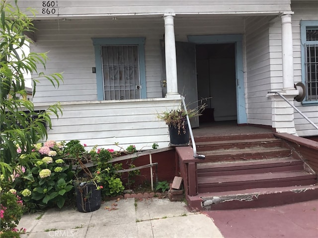 entrance to property with covered porch