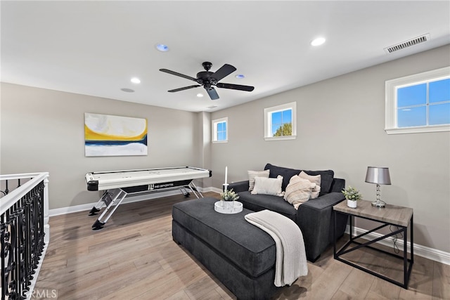 bedroom featuring ceiling fan and light hardwood / wood-style floors