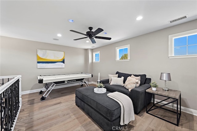 bedroom with ceiling fan and light hardwood / wood-style floors