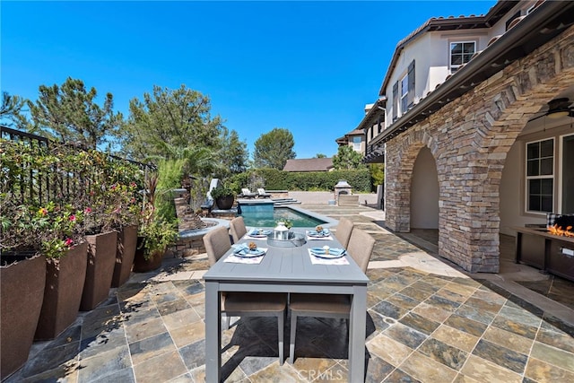 view of patio / terrace with a fenced in pool