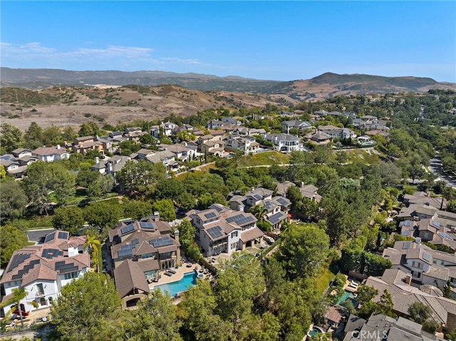 birds eye view of property with a mountain view