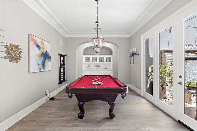 playroom with light hardwood / wood-style flooring, ornamental molding, french doors, and pool table