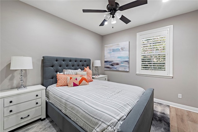 bedroom with hardwood / wood-style floors and ceiling fan