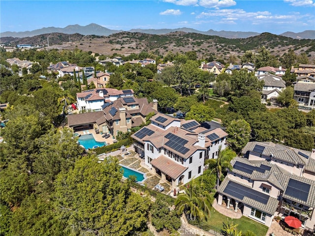 birds eye view of property featuring a mountain view