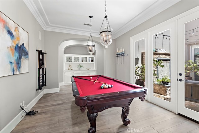 playroom featuring hardwood / wood-style floors, french doors, crown molding, and billiards