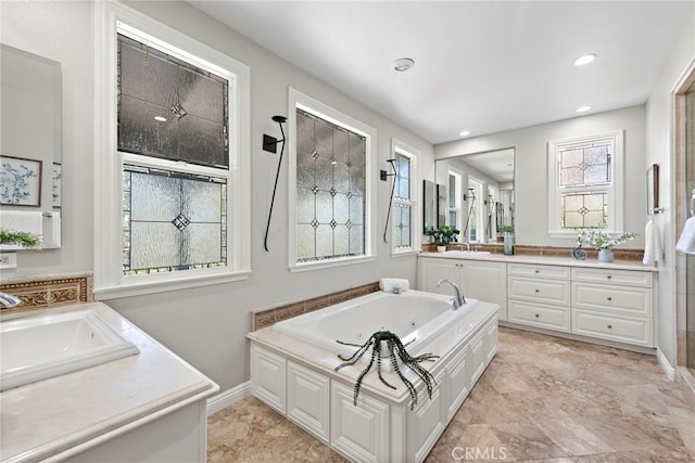 bathroom with vanity and a bathtub