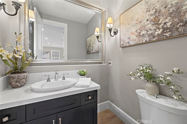 bathroom with tile patterned floors, vanity, and toilet