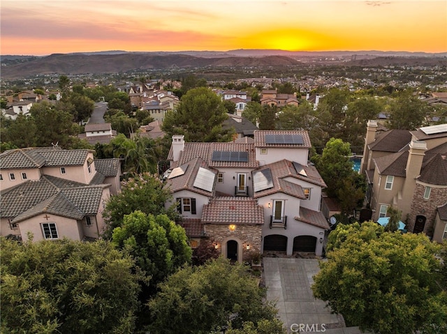 birds eye view of property with a residential view and a mountain view