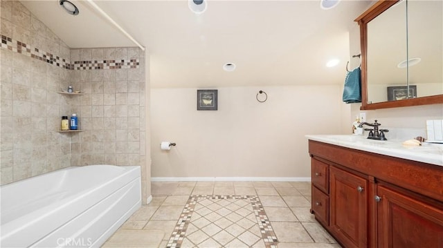 bathroom featuring vanity, tiled shower / bath combo, and tile patterned floors