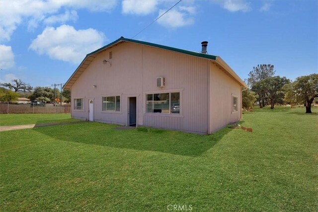 back of house featuring a yard