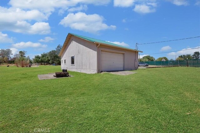 garage with a lawn