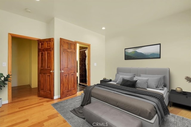 bedroom with hardwood / wood-style floors