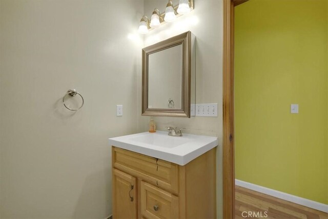 bathroom featuring vanity and hardwood / wood-style floors