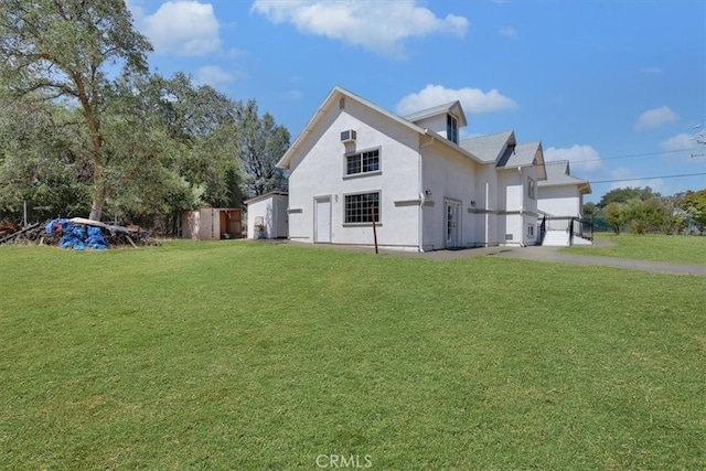 view of property exterior featuring a yard and a garage