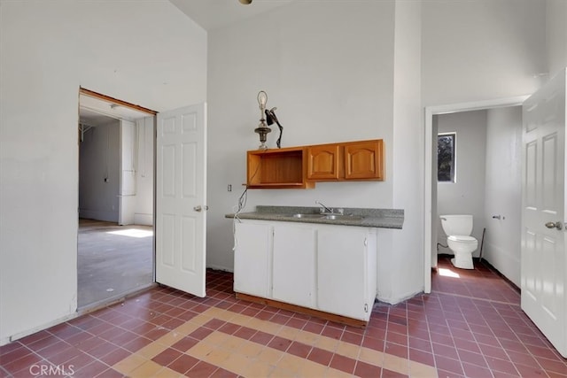 kitchen featuring light tile patterned flooring and sink