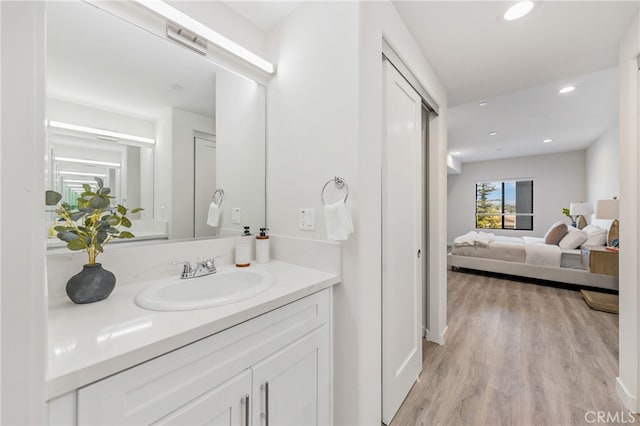 bathroom featuring vanity and hardwood / wood-style floors