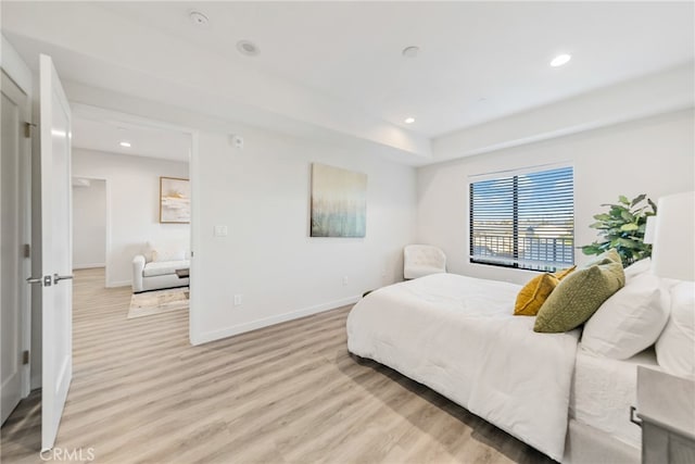 bedroom with light hardwood / wood-style flooring