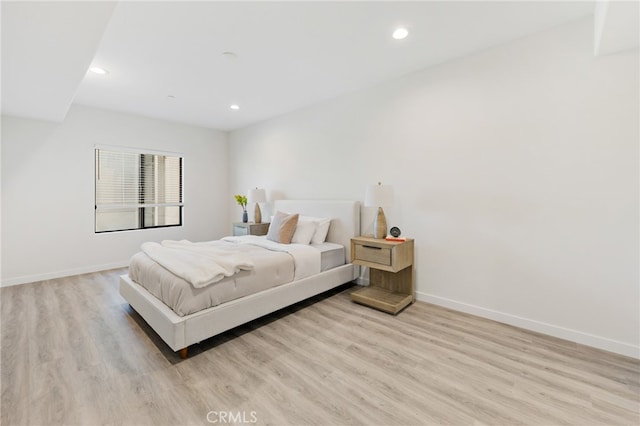 bedroom with light hardwood / wood-style floors