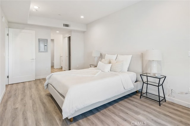 bedroom with light hardwood / wood-style floors