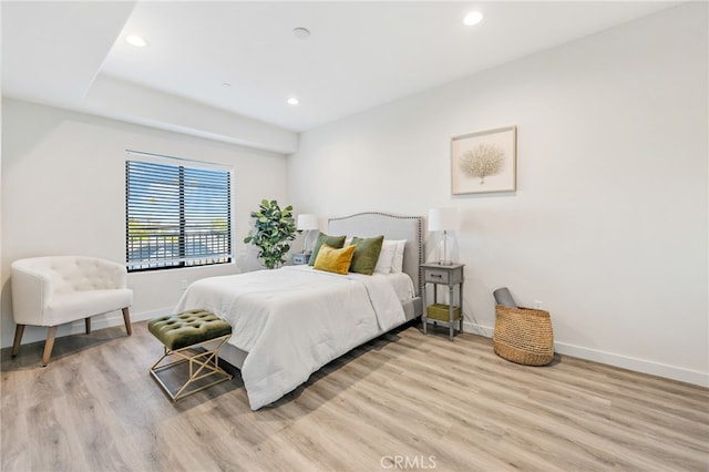 bedroom with light hardwood / wood-style flooring