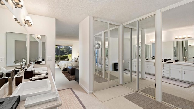 bathroom featuring vanity and a textured ceiling