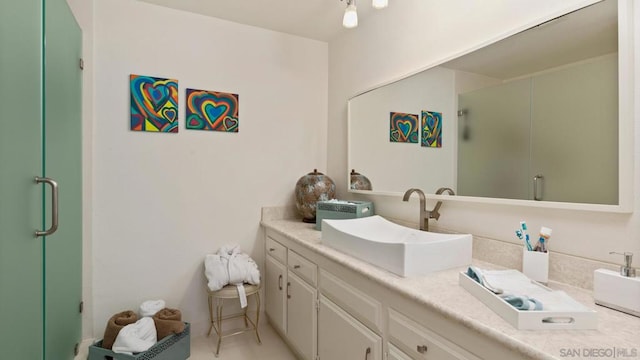 bathroom with vanity and an enclosed shower