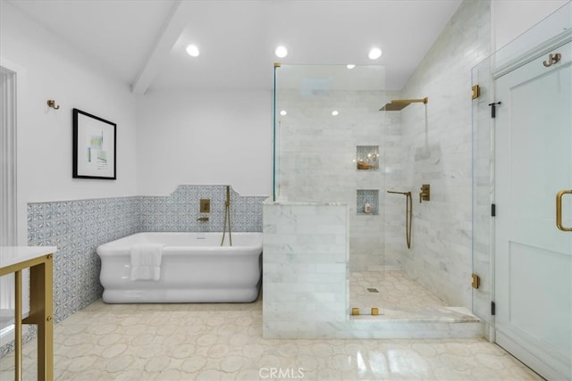 bathroom featuring plus walk in shower and tile walls