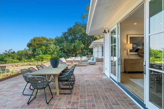 view of patio featuring french doors and an outdoor living space