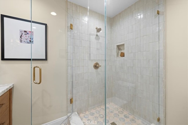 bathroom featuring vanity and an enclosed shower