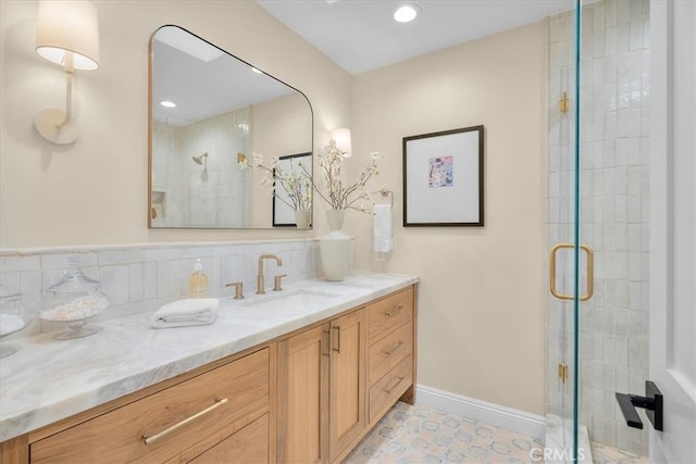 bathroom with vanity and an enclosed shower