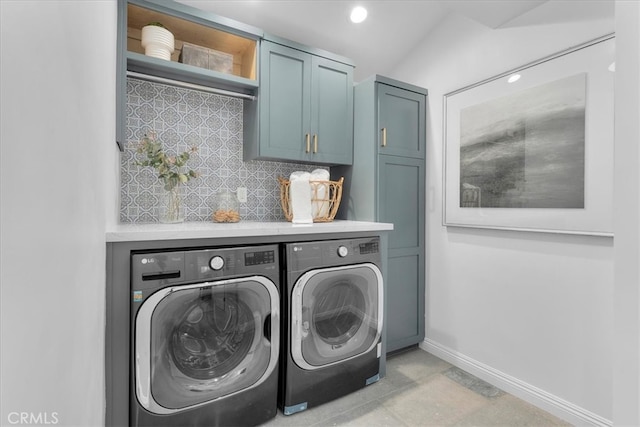 washroom with cabinets and separate washer and dryer