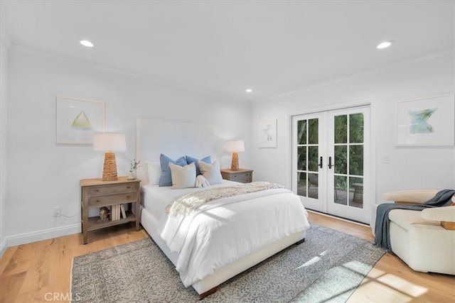 bedroom featuring french doors, crown molding, access to outside, and hardwood / wood-style floors