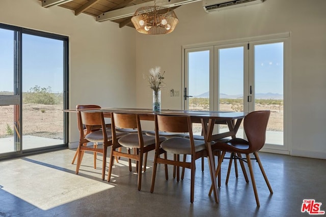 dining area featuring concrete flooring, an AC wall unit, beamed ceiling, a notable chandelier, and wood ceiling