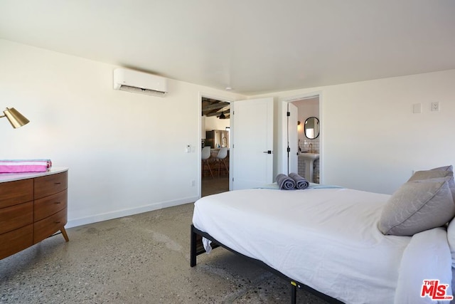 bedroom featuring an AC wall unit and ensuite bathroom